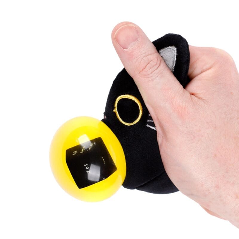 Squeezing Lucky the Black Cat to reveal the hidden fortune ball
