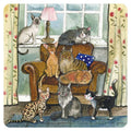 Alex Clark Cat House square coaster showing a cosy armchair surrounded by cats of different colours and breeds