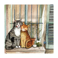 Alex Clark Provence Cats fridge magnet featuring a grey and white cat cuddling a ginger cat together on a sunny windowsill