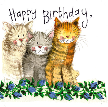 Alex Clark Large Sparkle birthday card featuring three smiling cream, grey and ginger cats with glittery cheeks above blue flowers and Happy Birthday wording.