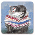Alex Clark Laundry Basket Cat single cork-backed coaster featuring a sleeping grey tabby cat curled up on a stack of freshly folded laundry in a wicker basket with blue watercolour background.