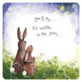 Alex Clark You, Me and The Starlight coaster featuring two rabbits sitting with their arms around each other in a wildflower meadow beneath the stars.