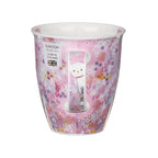 Dunoon Tiddles Nevis Fine Bone China cat mug showing the pink meadow decoration continuing onto the handle with a cute cat face peeking out