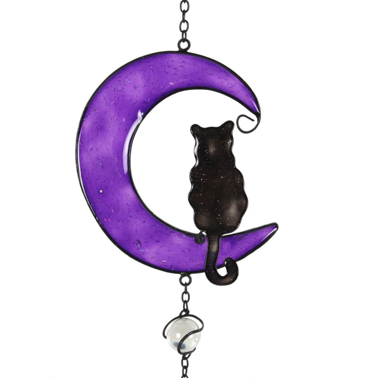 Detail of black cat sitting inside purple crescent moon with decorative glass bead